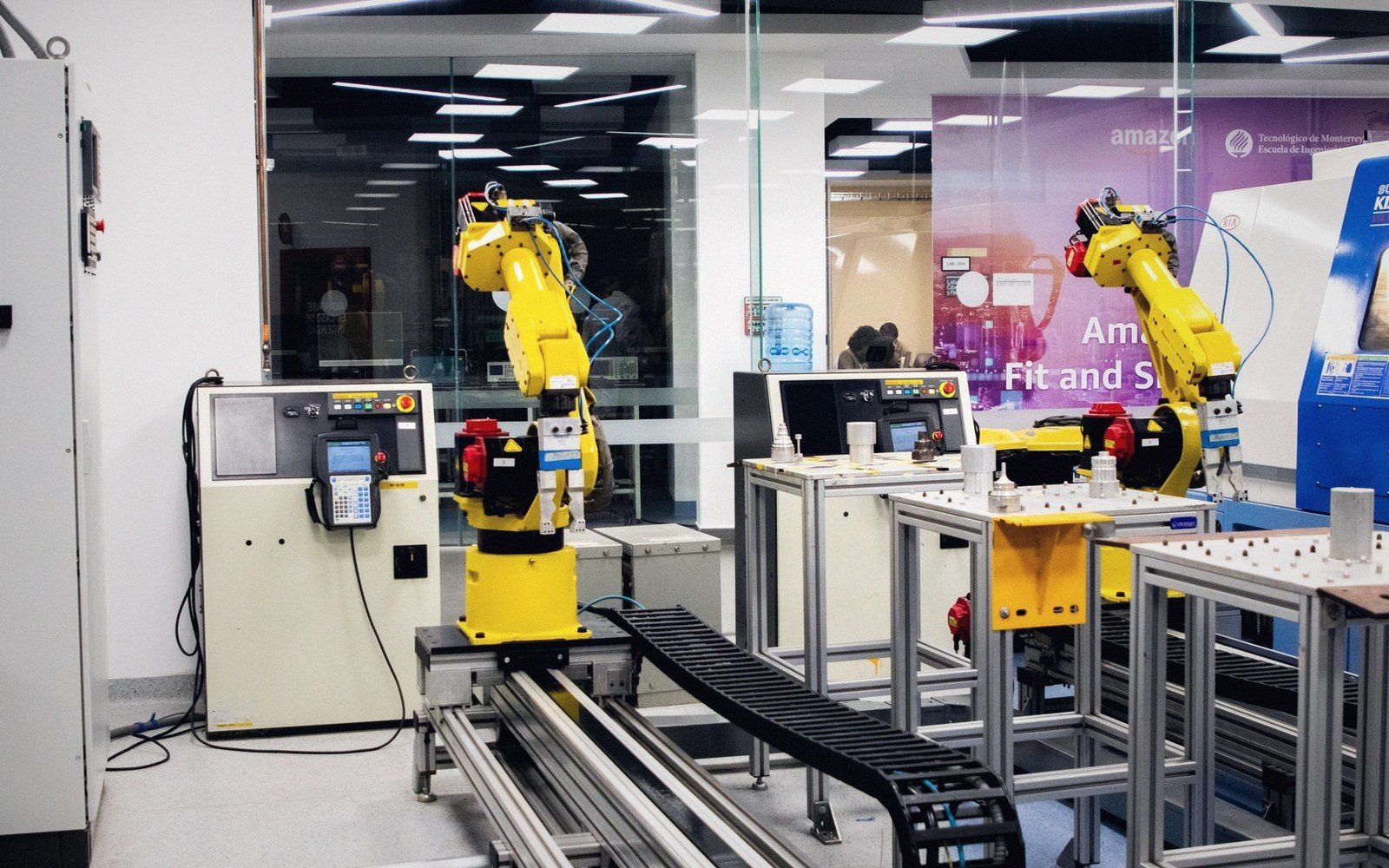 Cable dress looping down a robot upper arm